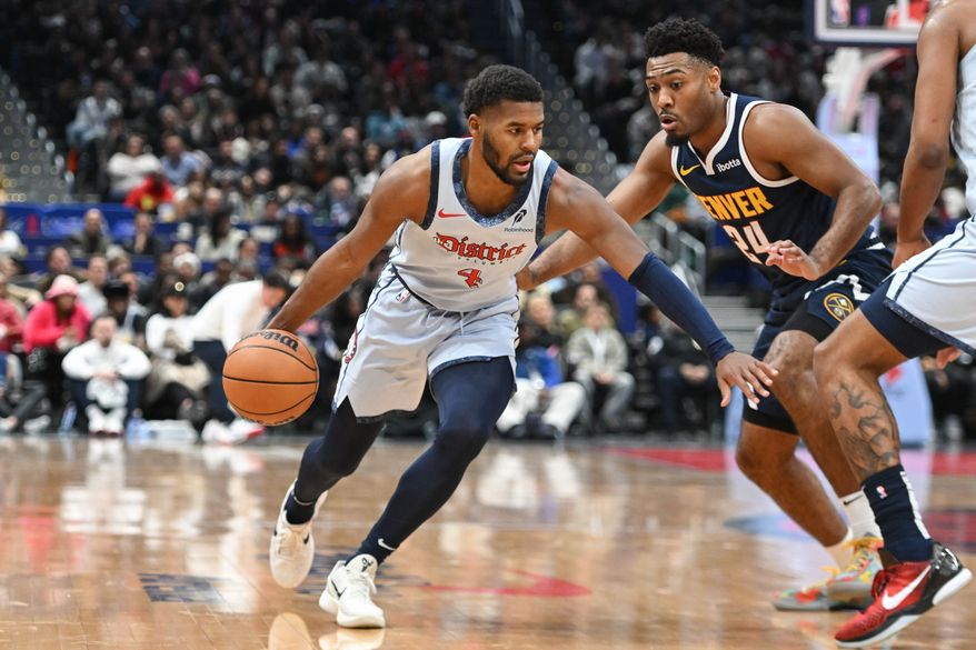 Washington Wizards guard Jared Butler (4) driving towards the basket during the fourth quarter of an NBA game against the Denver Nuggets at Capital One Arena in Washington D.C., December 7, 2024. (Photo for the Washington Times)