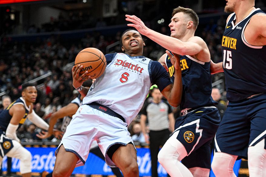 Washington Wizards guard Bub Carrington (8) trying to put the ball up during the fourth quarter of an NBA game against the Denver Nuggets at Capital One Arena in Washington D.C., December 7, 2024. (Photo for the Washington Times)