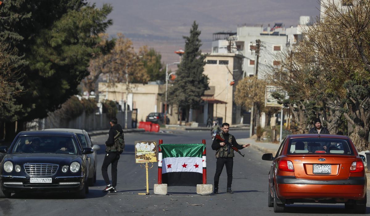 NextImg:Syrian premier says government still functioning, but foreign and domestic challenges loom