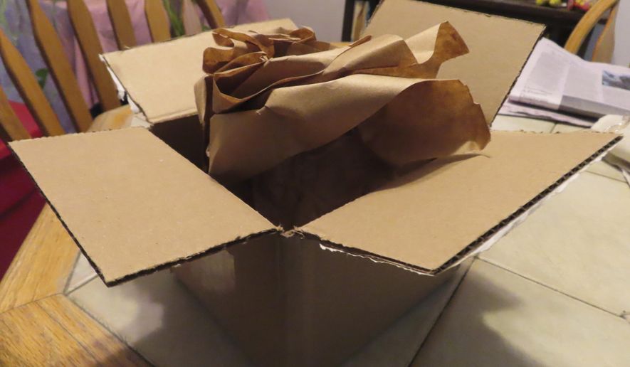 Paper packaging materials sit inside a just-opened box in Point Pleasant, N.J. on Tuesday, Dec. 10, 2024. (AP Photo/Wayne Parry)