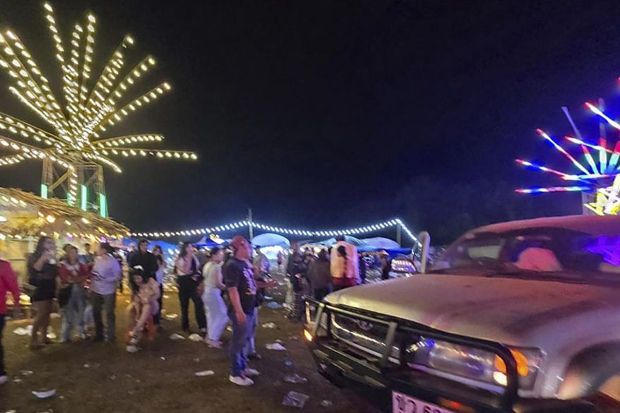 This photo provided by Umphang Rescue shows a site scene where an explosive device was thrown into a crowd during an annual festival Umphang, Tak province Thailand, Friday, Dec. 13, 2024. (Umphang Rescue via AP)