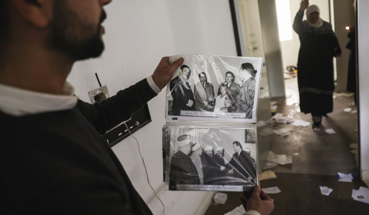 NextImg:Candid photos of Syria’s Assad expose a world beyond the carefully crafted and repressive rule