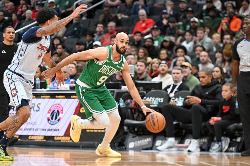 Boston Celtics guard Derrick White (9) driving to the hoop during the first quarter of an NBA game against the Washington Wizards at Capital One Arena in Washington D.C., December 15, 2024. (Photo for the Washington Times)