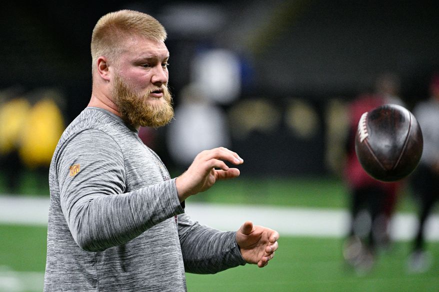 Washington Commanders center Tyler Biadasz (63) works out for trainers before an illness caused him to be declared inactive against the New Orleans Saints at Caesars Superdome, New Orleans, La., December 15, 2024. (Photo by Brian Murphy for the Washington Times)