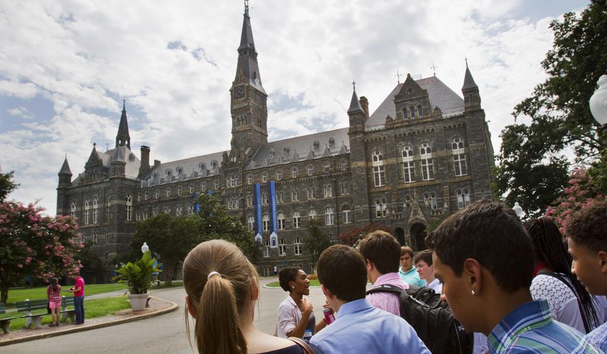 Prospective students tour Georgetown University's campus in Washington, July 10, 2013. (AP Photo/Jacquelyn Martin, File)