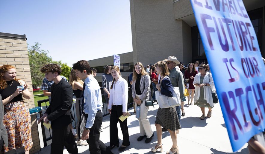 Youth plaintiffs in the Held v. Montana climate case leave the Montana Supreme Court, on July 10, 2024, in Helena, Mont. (Thom Bridge/Independent Record via AP, File)
