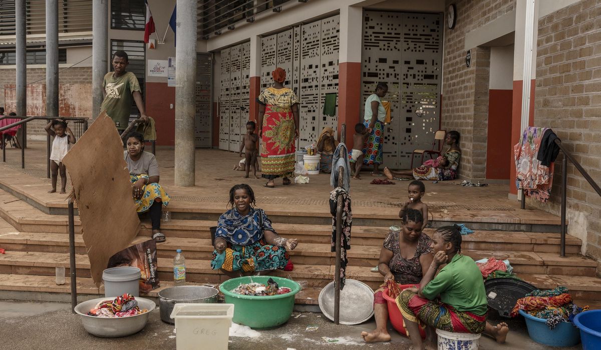 NextImg:Crowds in Mayotte vent frustration with cyclone response as Macron tours devastation