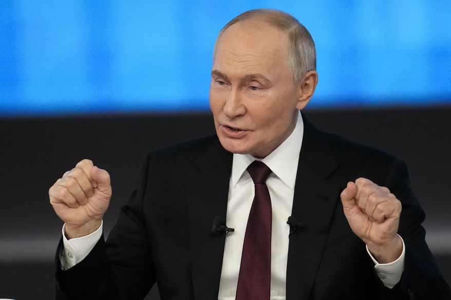 Russian President Vladimir Putin gestures while speaking during his annual news conference and call-in show at Gostinny Dvor in Moscow, Russia, Thursday, Dec. 19, 2024. (AP Photo/Alexander Zemlianichenko)