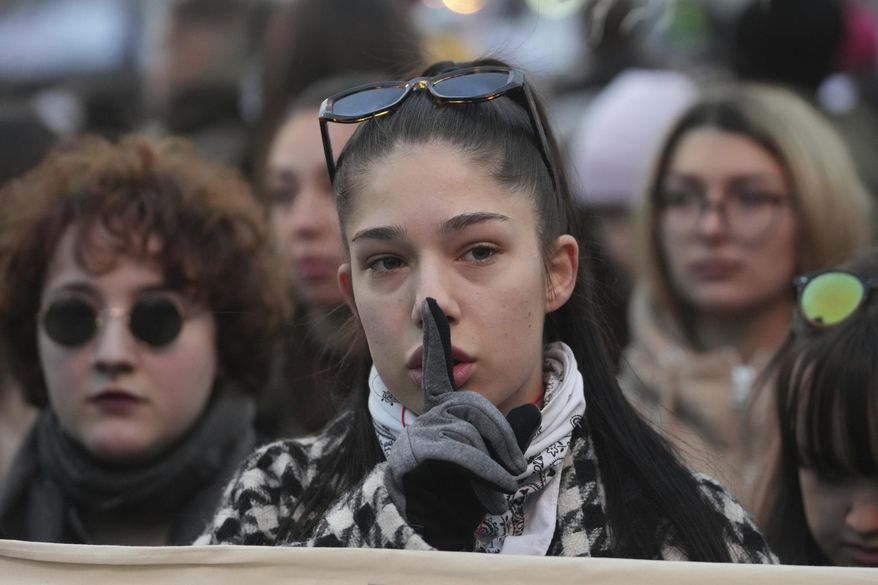 People attend a protest against the Serbian authorities in Belgrade, Serbia, Sunday, Dec. 22, 2024. (AP Photo/Darko Vojinovic)