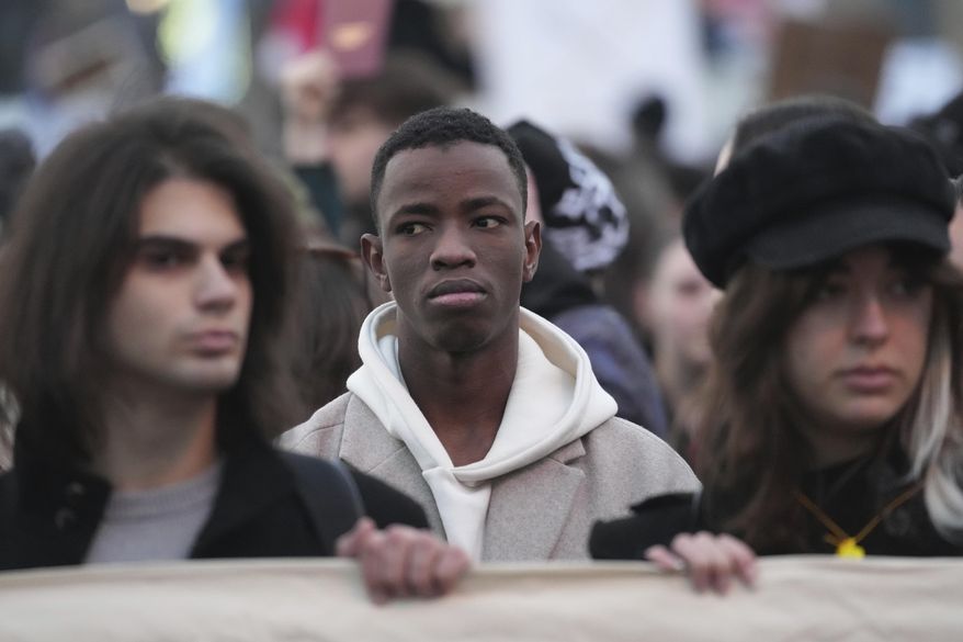 People attend a protest against the Serbian authorities in Belgrade, Serbia, Sunday, Dec. 22, 2024. (AP Photo/Darko Vojinovic)