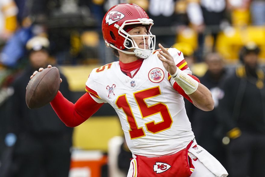 Kansas City Chiefs quarterback Patrick Mahomes (15) passes against the Pittsburgh Steelers during the first half of an NFL football game, Wednesday, Dec. 25, 2024, in Pittsburgh. (AP Photo/Matt Freed)