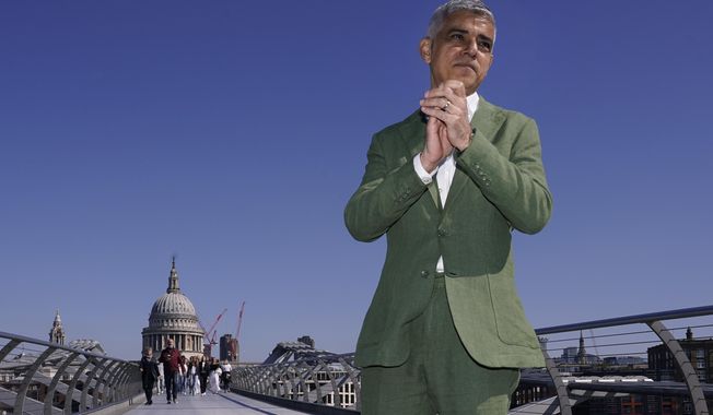 The newly re-elected Labour Party Mayor of London Sadiq Khan poses for the media on the Millennium Bridge before his swearing-in ceremony in London, Tuesday, May 7, 2024. (AP Photo/Alberto Pezzali) **FILE**