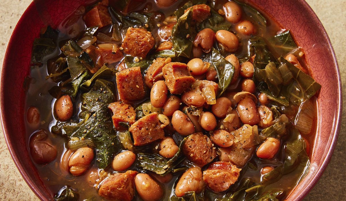 NextImg:Flavorful chorizo brings meaty depth to a paprika pinto bean soup with collard greens