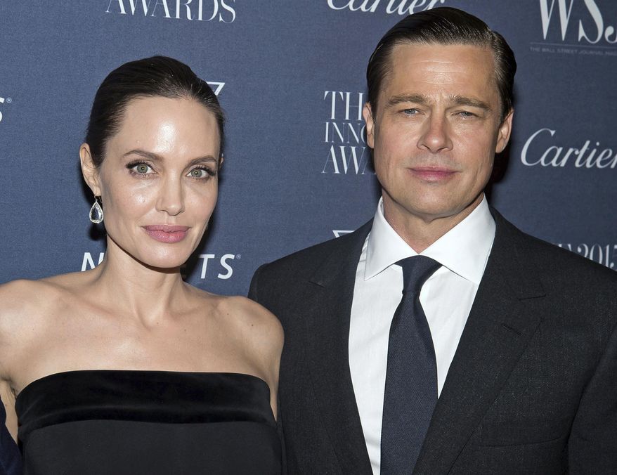 Angelina Jolie Pitt and Brad Pitt pose for a photo at the WSJ Magazine Innovator Awards 2015 at The Museum of Modern Art in New York on Nov. 4, 2015. (Photo by Charles Sykes/Invision/AP) **FILE**