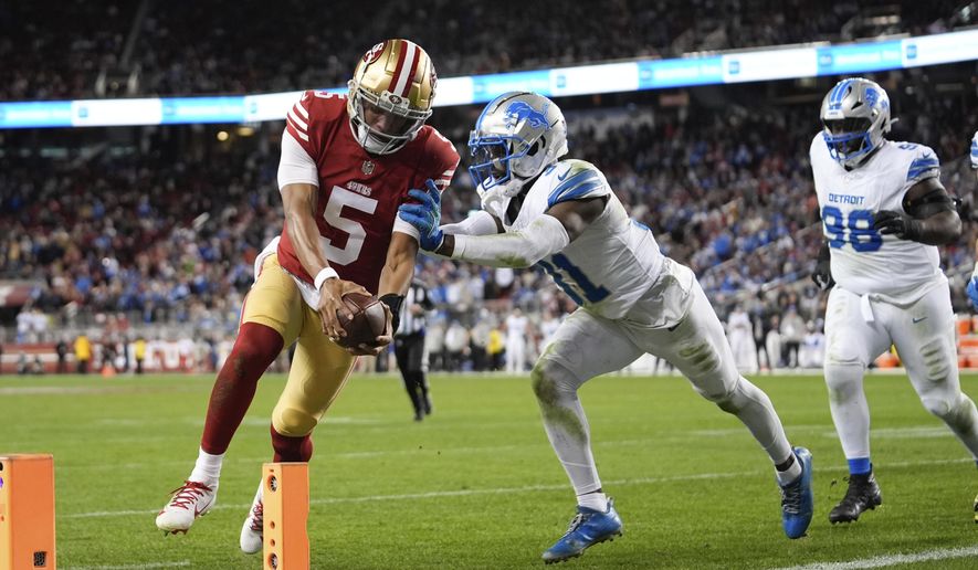 San Francisco 49ers quarterback Joshua Dobbs (5) scores a touchdown during the second half of an NFL football game against the Detroit Lions, Monday, Dec. 30, 2024, in Santa Clara, Calif. (AP Photo/Godofredo A. Vásquez)