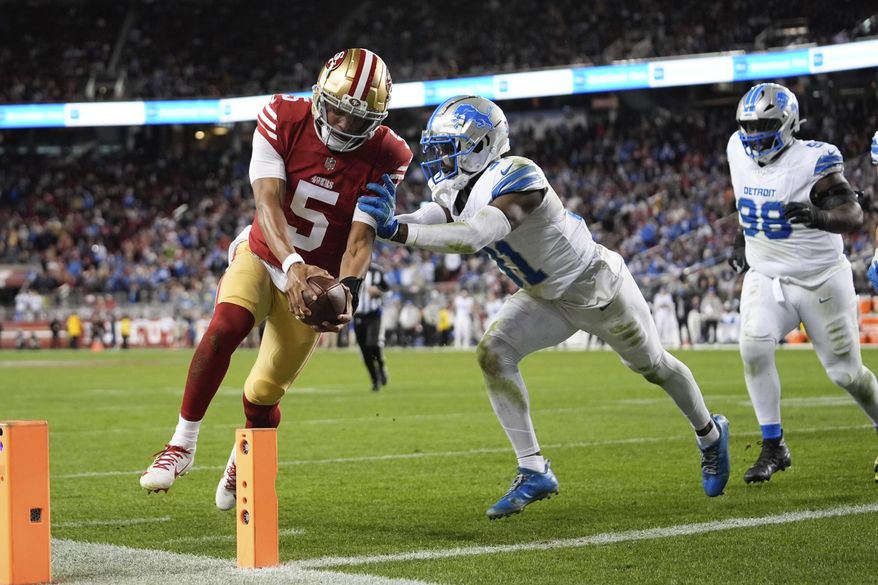 San Francisco 49ers quarterback Joshua Dobbs (5) scores a touchdown during the second half of an NFL football game against the Detroit Lions, Monday, Dec. 30, 2024, in Santa Clara, Calif. (AP Photo/Godofredo A. Vásquez)
