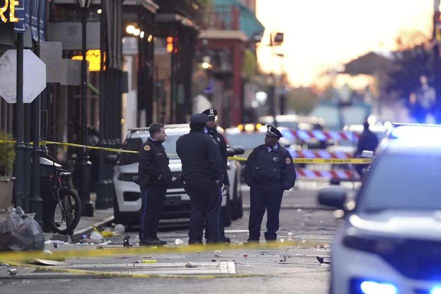 Emergency services attend to the scene on Bourbon Street after a vehicle drove into a crowd on New Orleans' Canal and Bourbon Street on Wednesday, Jan. 1, 2025. (AP Photo/Gerald Herbert, File)