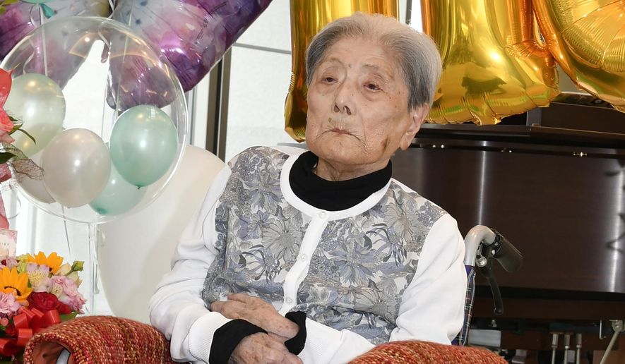 This photo provided by Ashiya City shows Tomiko Itooka, being celebrated for her 116th birthday at the nursing home she lives in Ashiya, western Japan, on May 23, 2024. (Ashiya City via AP, File)