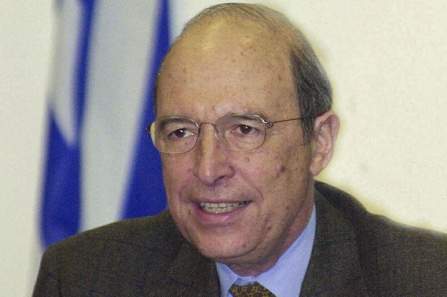 FILE - Greece's Prime Minister Costas Simitis declares a razor-thin victory over conservative opponents following general elections, in Athens on Monday, April 10, 2000. Costas Simitis, a Prime Minister of Greece from 1996 to 2004 and the architect of the country's joining the common European currency, the euro, has died at 88, state TV ERT reports. (AP Photo/Thanassis Stavrakis, File)