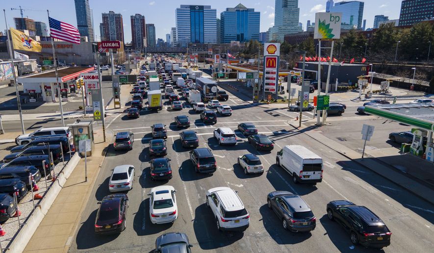 FILE - Commuters wait to drive through the Holland Tunnel into New York City during morning rush hour traffic, in Jersey City, N.J., March 8, 2023. (AP Photo/Ted Shaffrey, File)