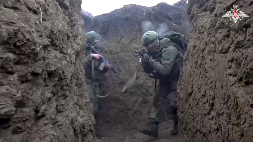 In this photo taken from video distributed by Russian Defense Ministry Press Service on Saturday, Jan. 4, 2025, Russian servicemen attend a combat training for assault units in an undisclosed location. (Russian Defense Ministry Press Service via AP)