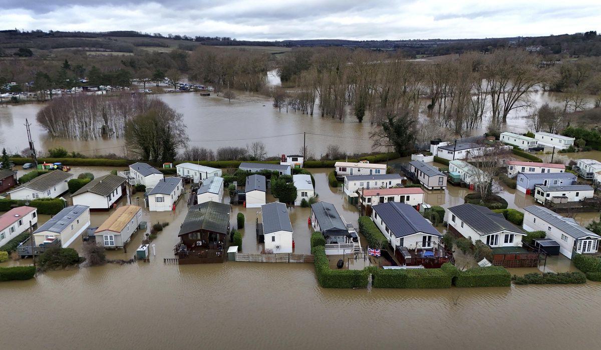 NextImg:Rain and snow lead to flooding and disrupt travel in parts of the U.K.
