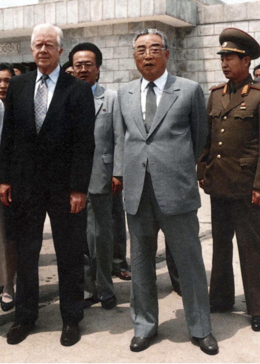 FILE - This photo provided by the North Korean government shows former U.S. President Jimmy Carter, left, and then North Korean President Kim Il Sung looking at the West Sea Barrage in Nampo, North Korea, on June 17, 1994. (Korean Central News Agency/Korea News Service via AP, File)
