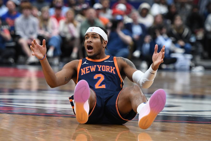 New York Knicks guard Miles McBride (2) on the floor looking for a foul call during the third quarter of an NBA game against the Washington Wizards at Capital One Arena in Washington D.C., December 30, 2024. (Photo for the Washington Times).