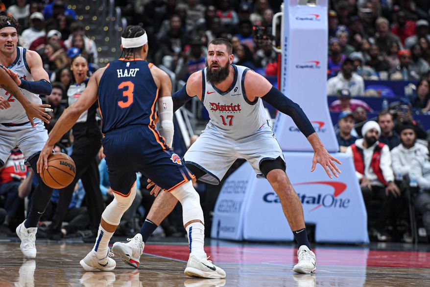 Washington Wizards center Jonas Valanciunas (17) defending against New York Knicks forward Josh Hart (3) during the fourth quarter of an NBA game at Capital One Arena in Washington D.C., December 30, 2024. (Photo for the Washington Times).