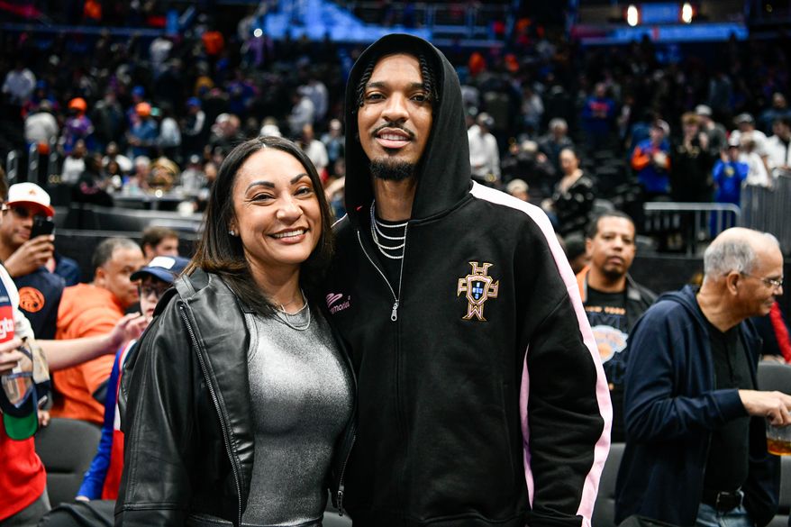 Washington Commanders quarterback Jayden Daniels with his mother Regina Jackson during an NBA game between the Washington Commanders and the New York Knicks at Capital One Arena in Washington D.C., December 30, 2024. (Photo for the Washington Times).