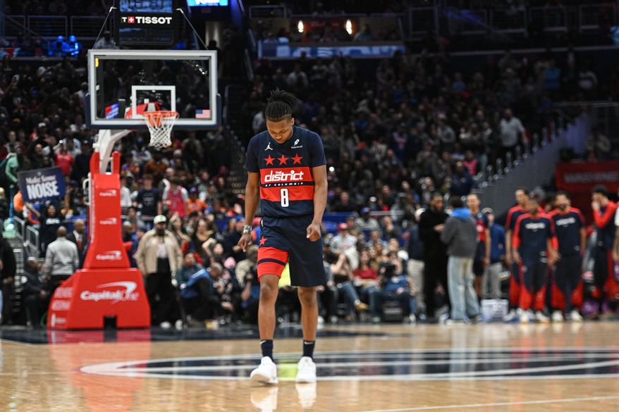 Washington Wizards guard Bub Carrington (8) walking on the court after a timeout during the fourth quarter of an NBA game against the New York Knicks at Capital One Arena in Washington D.C., December 28, 2024. (Photo for the Washington Times).