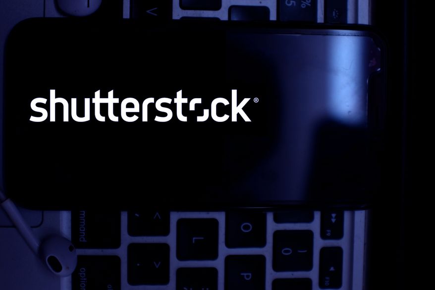 Smartphone with the Shutterstock logo. (Image by Daniel Constante/Shutterstock) ** FILE **
