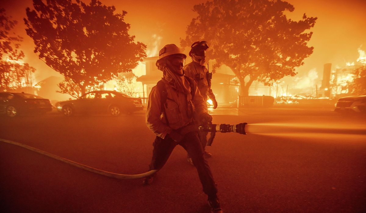 NextImg:Thousands flee as wildfires burn out of control in and around Los Angeles, and homes are destroyed