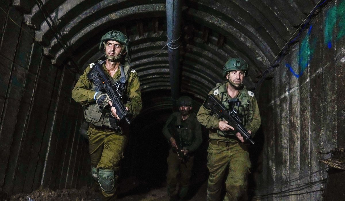 NextImg:Israeli troops discover Hamas weapons stored inside Gaza Strip school building