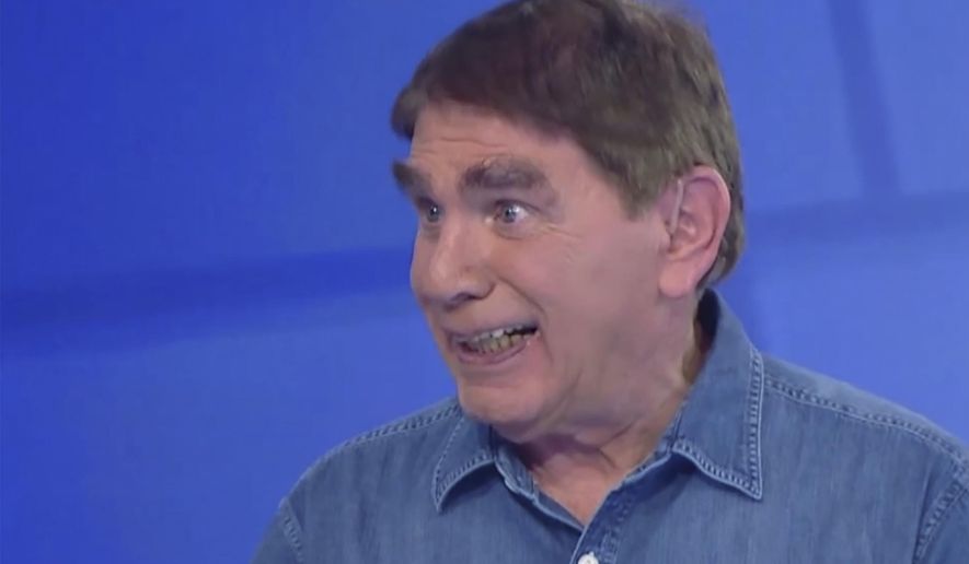 In this frame grab taken from video provided by CHANNEL 12 NEWS, Israeli journalist Moshe Nussbaum whose speech is impaired due to ALS (amyotrophic lateral sclerosis), talks in a studio, Neve Ilan, Israel, on Dec. 28, 2024. (CHANNEL 12 NEWS via AP)
