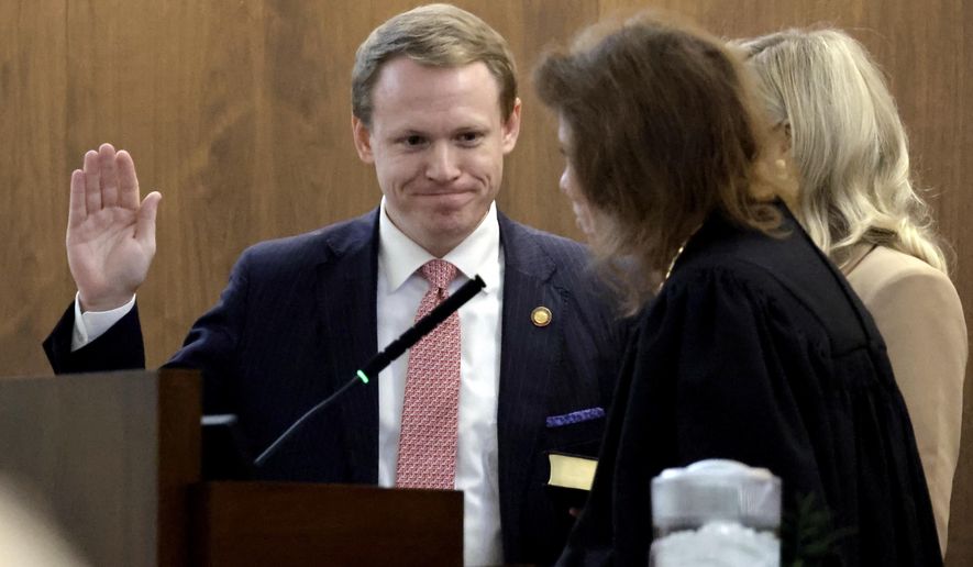 North Carolina House Speaker Destin Hall takes the oath of office after he was chosen Speaker for the 2025 session at the Legislative Building, Wednesday, Jan. 8, 2025, in Raleigh, N.C. (AP Photo/Chris Seward)