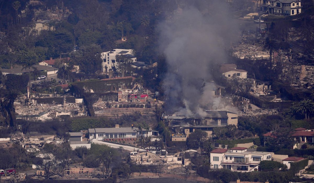 NextImg:Calmer winds aid firefighters in Los Angeles as death toll rises