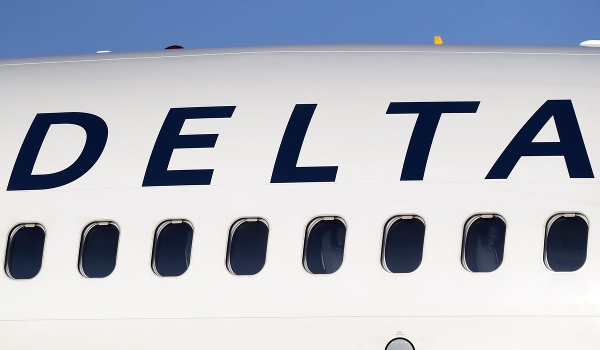 NextImg:Passengers on Delta plane at Atlanta airport deplane onto runway using slides, four injured