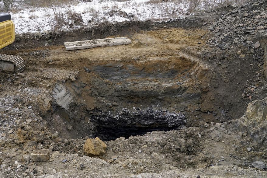 The sinkhole, where the remains of Elizabeth Pollard was found, Friday, Dec. 6, 2024, is shown in Marguerite, Pa. (AP Photo/Matt Freed, File)