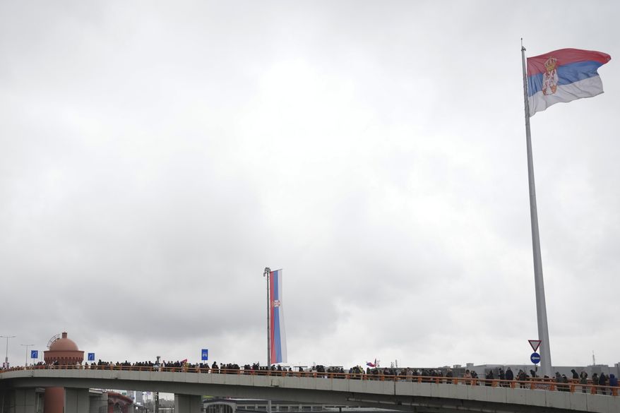 Students march during a protest over the collapse of a concrete canopy that killed 15 people more than two months ago, in Belgrade, Serbia, Friday, Jan. 10, 2025. (AP Photo/Darko Vojinovic)