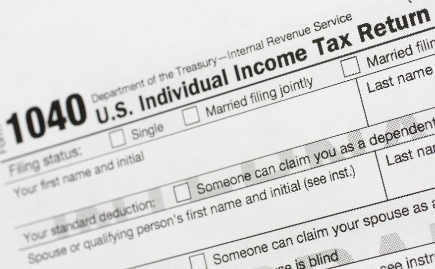 Part of a 1040 U.S. Individual Income Tax Return form is shown in New York on July 24, 2018. (AP Photo/Mark Lennihan) **FILE**