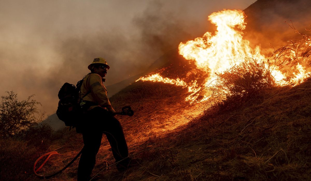NextImg:Arson arrests grow as Los Angeles battles sprawling blaze