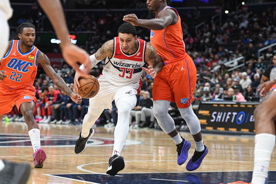 Washington Wizards forward Kyle Kuzma (33) driving to the hoop during the first quarter of an NBA game against the Oklahoma City Thunder at Capital One Arena in Washington D.C., January 12, 2025. (Photo for the Washington Times)