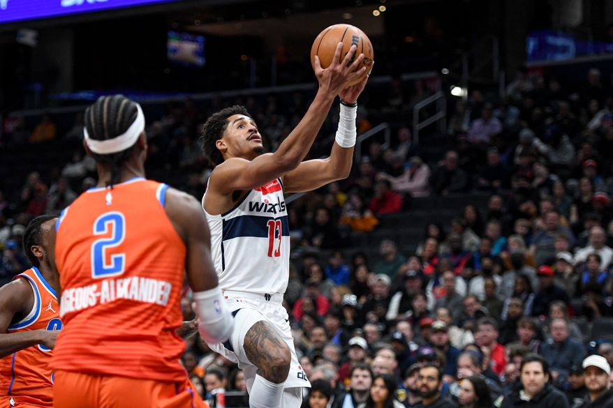Washington Wizards guard Jordan Poole (13) putting the ball up during the first quarter of an NBA game against the Oklahoma City Thunder at Capital One Arena in Washington D.C., January 12, 2025. (Photo for the Washington Times)