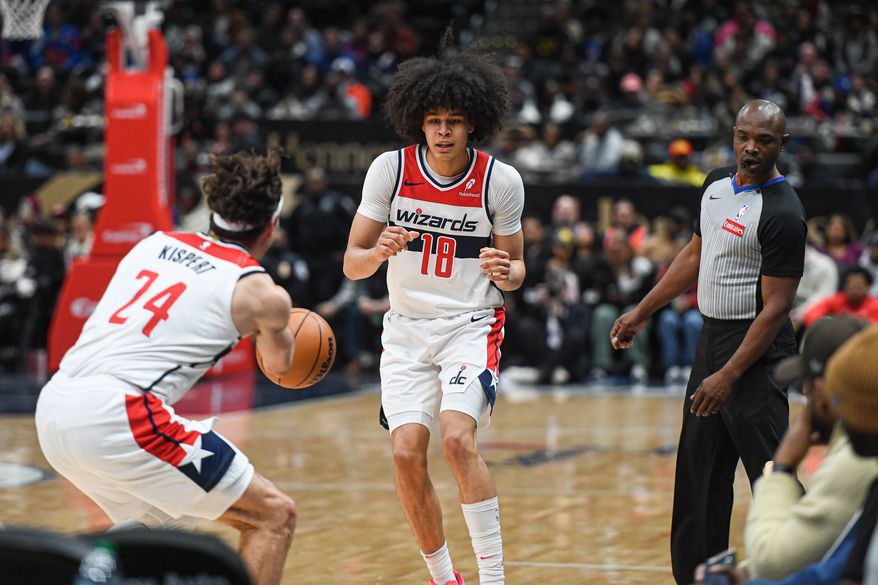 Washington Wizards forward Kyshawn George (18) receiving a pass from Corey Kispert (24) during the third quarter of an NBA game against the Oklahoma City Thunder at Capital One Arena in Washington D.C., January 12, 2025. (Photo for the Washington Times)
