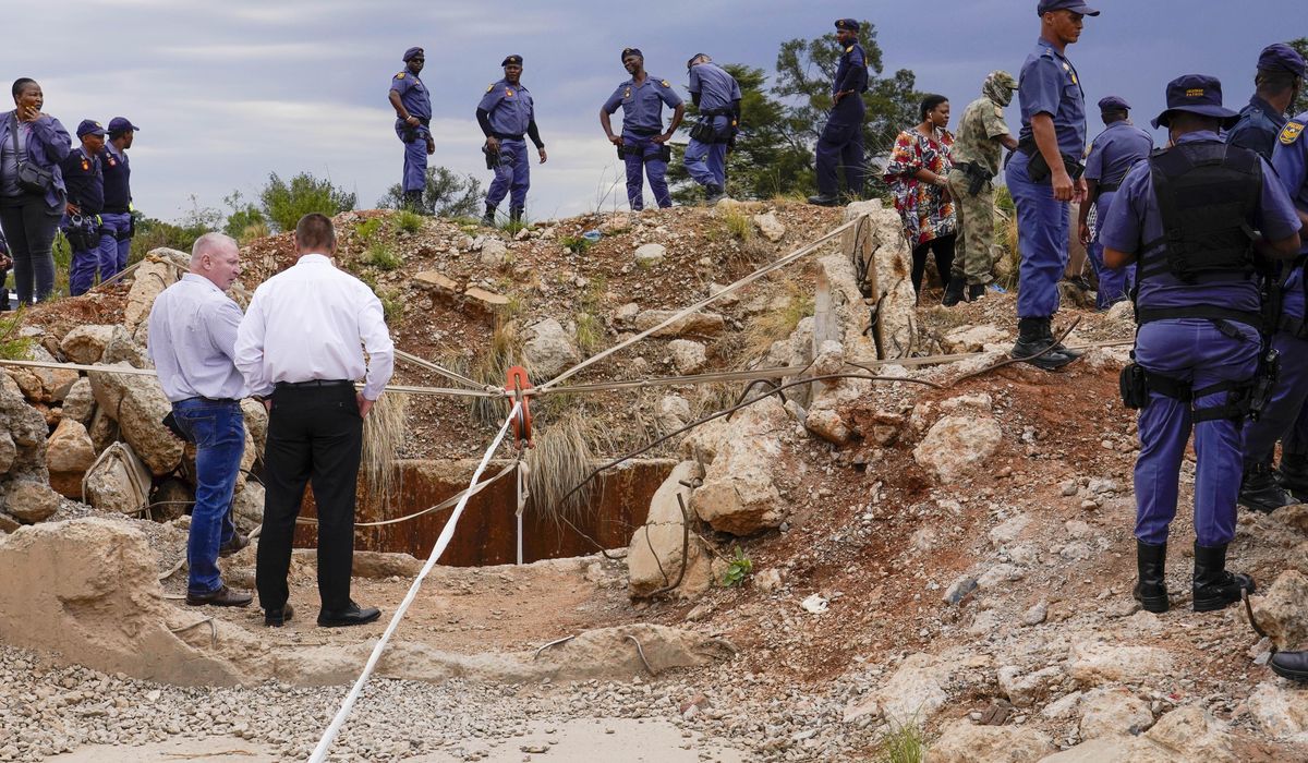 NextImg:At least 100 illegal miners have died while trapped in a South African mine, group says
