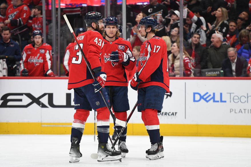 Washington Capitals players Tom Wilson (43), Jakob Chychrun (6) and Dylan Strome (17) talk it over during a break in the action during the second period of an NHL game against the Anaheim Ducks at Capital One Arena in Washington D.C. on January 14, 2025. (Photo for the Washington Times)