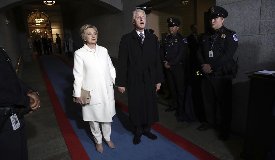 Former Sen. Hillary Clinton and former President Bill Clinton arrive on the West Front of the U.S. Capitol, in Washington, Jan. 20, 2017, for the inauguration ceremony of Donald J. Trump as the 45th president of the United States. (Win McNamee/AP Photo) **FILE**