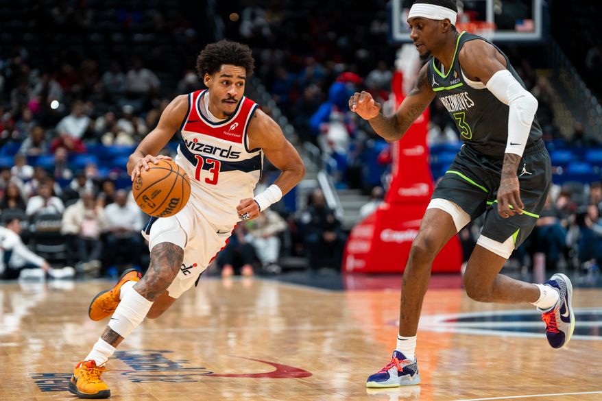 Washington Wizards Guard Jordan Poole (13) dribbles to find space against Minnesota Timberwolves Forward Jaden McDaniels (3) at Capital One Arena, Washington, D.C., January 13th, 2025. (Photo by Jordan Sabillo, for the Washington Times)