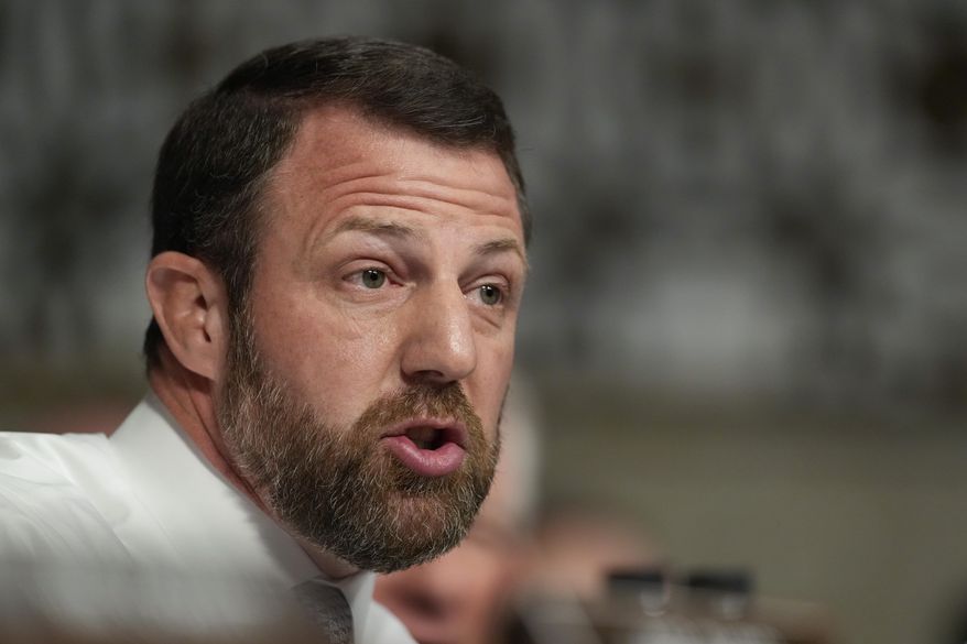 Sen. Markwayne Mullin, R-Oklahoma., speaks during the Senate Armed Services Committee confirmation hearing for Pete Hegseth, President-elect Donald Trump's choice to be Defense secretary, at the Capitol in Washington, Tuesday, Jan. 14, 2025. (AP Photo/Ben Curtis)